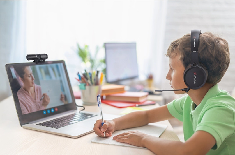 Hybrid learning is here to stay. A student using AVerMedia webcam and microphone for hybrid lessons.